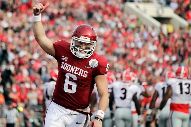 FILE - In this Jan. 1, 2018, file photo, Oklahoma quarterback Baker Mayfield celebrates after running back Rodney Anderson scored a touchdown against Georgia during the first half of the Rose Bowl NCAA college football game in Pasadena, Calif. Mayfield is expected to be a first round pick in the NFL Draft.(AP Photo/Jae C. Hong, File)