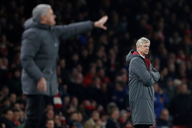 Manchester United's Portuguese manager Jose Mourinho (L) and Arsenal's French manager Arsene Wenger watch the players from the touchline during the English Premier League football match between Arsenal and Manchester United at the Emirates Stadium in London on December 2, 2017.  / AFP PHOTO / Adrian DENNIS / RESTRICTED TO EDITORIAL USE. No use with unauthorized audio, video, data, fixture lists, club/league logos or 'live' services. Online in-match use limited to 75 images, no video emulation. No use in betting, games or single club/league/player publications.  /         (Photo credit should read ADRIAN DENNIS/AFP/Getty Images)