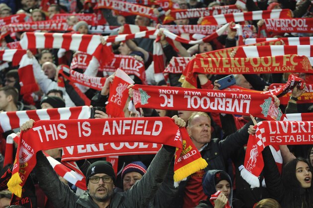 Liverpool fans sing and hold up scarves prior to the Champions League semifinal, first leg, soccer match between Liverpool and Roma at Anfield Stadium, Liverpool, England, Tuesday, April 24, 2018. (AP Photo/Rui Vieira)