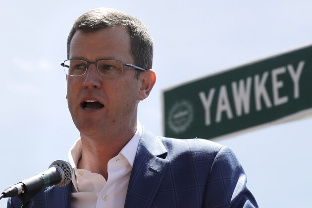 FILE - In this June 22, 2017, file photo, Boston Red Sox president Sam Kennedy addresses a gathering where a portion of Yawkey Way was renamed David Ortiz Drive, to honor the retired Red Sox designated hitter, outside Fenway Park in Boston. Red Sox principal owner John Henry says he wants to take steps to rename all of Yawkey Way, a street that has been an enduring reminder of the franchise's complicated racial past. (AP Photo/Charles Krupa, File)