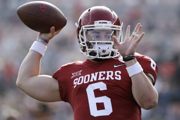 Oklahoma quarterback Baker Mayfield passes during warmups before the Rose Bowl NCAA college football game against Georgia, Monday, Jan. 1, 2018, in Pasadena, Calif. (AP Photo/Gregory Bull)