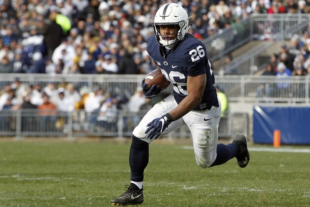 Penn State's Saquon Barkley (26) runs the ball against Rutgers during the second half of an NCAA college football game in State College, Pa., Saturday, Nov. 11, 2017. Penn State 35-6. (AP Photo/Chris Knight)