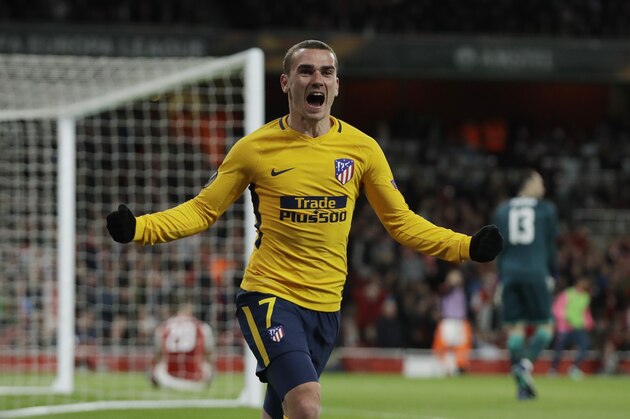Atletico's Antoine Griezmann celebrates after scoring the first goal of his team during the Europa League semifinal first leg soccer match between Arsenal FC and Atletico Madrid at Emirates Stadium in London, Thursday, April 26, 2018. (AP Photo/Matt Dunham)