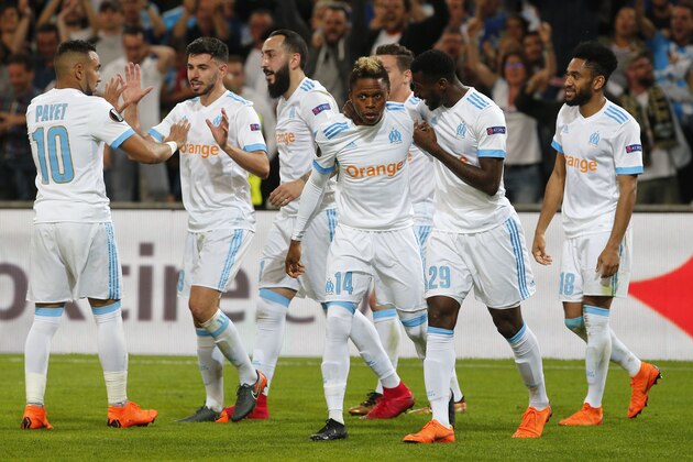 Marseille's Clinton N'Jie, center, celebrates with team mates after scoring his side's second goal during the Europa League semifinal first leg soccer match between Olympique Marseille and RB Salzburg at the Velodrome stadium in Marseille, France, Thursday, April 26, 2018. (AP Photo/Thibault Camus)