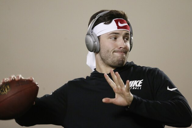 Oklahoma quarterback Baker Mayfield warms up during an NCAA college football Pro Day workout in Norman, Okla., Wednesday, March 14, 2018. (AP Photo/Sue Ogrocki)
