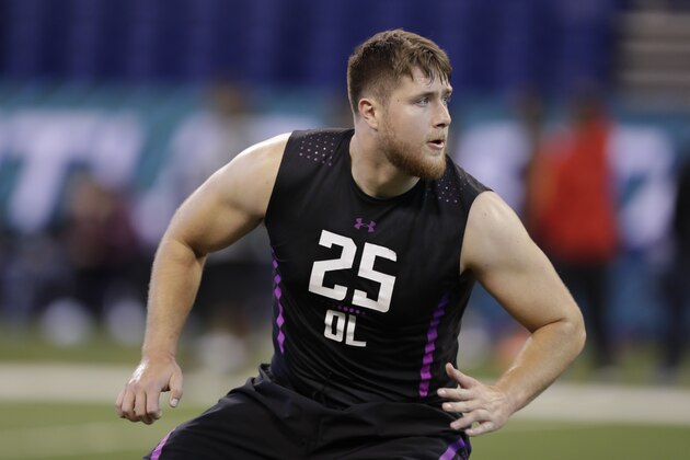 UCLA offensive lineman Kolton Miller runs a drill at the NFL football scouting combine in Indianapolis, Friday, March 2, 2018. (AP Photo/Michael Conroy)