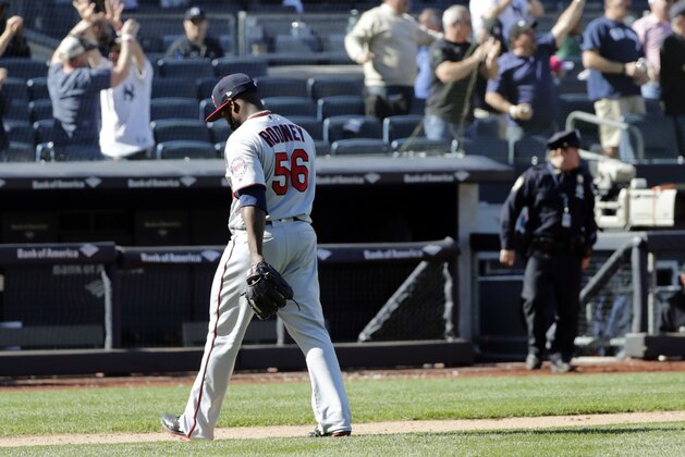 Minnesota Twins relief pitcher Fernando Rodney (56) leaves the field after New York Yankees' Gary Sanchez hit a three-run home run during the ninth inning of a baseball game Thursday, April 26, 2018, in New York. The Yankees won 4-3. (AP Photo/Frank Franklin II)