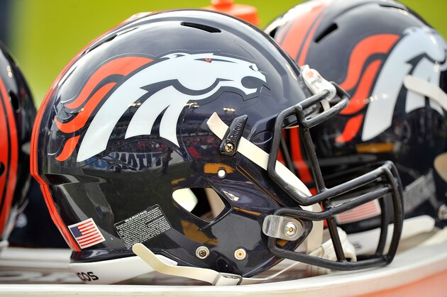 NASHVILLE, TN - DECEMBER 11:  A helmet of the Denver Broncos plays rests on a cooler during a game against the Tennessee Titans at Nissan Stadium on December 11, 2016 in Nashville, Tennessee.  (Photo by Frederick Breedon/Getty Images)