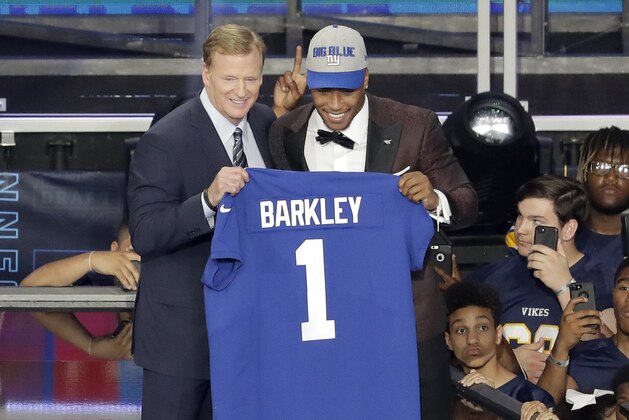 Penn State's Saquon Barkley, right, poses with commissioner Roger Goodell after being selected by the New York Giants during the first round of the NFL football draft, Thursday, April 26, 2018, in Arlington, Texas. (AP Photo/Eric Gay)