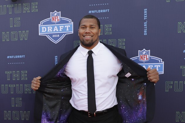 North Carolina State's Bradley Chubb poses for photos on the red carpet before the first round of the NFL football draft, Thursday, April 26, 2018, in Arlington, Texas. (AP Photo/Eric Gay)