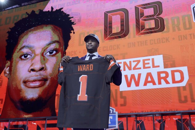 Ohio State's Denzel Ward poses with his Cleveland Browns jersey during the first round of the NFL football draft, Thursday, April 26, 2018, in Arlington, Texas. (AP Photo/David J. Phillip)