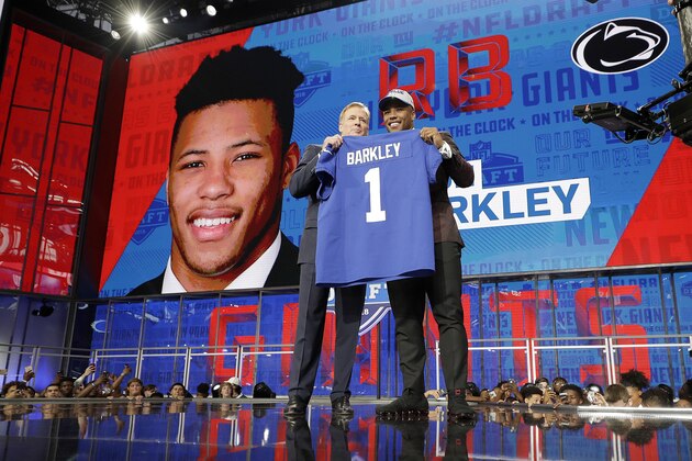 Penn State's Saquon Barkley, right, poses with commissioner Roger Goodell after being selected by the New York Giants during the first round of the NFL football draft, Thursday, April 26, 2018, in Arlington, Texas. (AP Photo/David J. Phillip)