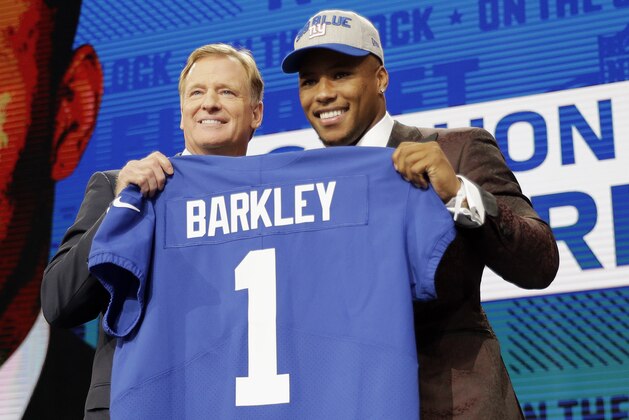 Penn State's Saquon Barkley, right, poses with commissioner Roger Goodell after being selected by the New York Giants during the first round of the NFL football draft, Thursday, April 26, 2018, in Arlington, Texas. (AP Photo/David J. Phillip)