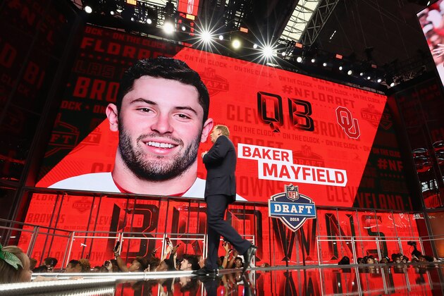 ARLINGTON, TX - APRIL 26:  NFL Commissioner Roger Goodell walks past a video board displaying an image of Baker Mayfield of Oklahoma after he was picked #1 overall by the Cleveland Browns during the first round of the 2018 NFL Draft at AT&T Stadium on April 26, 2018 in Arlington, Texas.  (Photo by Ronald Martinez/Getty Images)