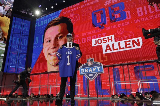 Wyoming's Josh Allen poses with his Buffalo Bills jersey during the first round of the NFL football draft, Thursday, April 26, 2018, in Arlington, Texas. (AP Photo/David J. Phillip)