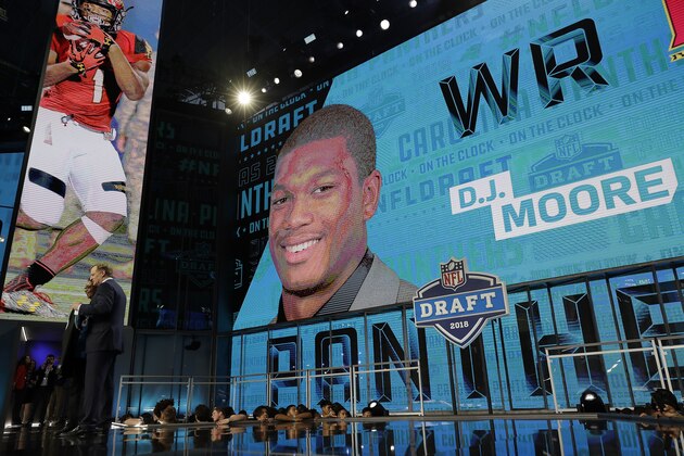 Commissioner Roger Goodell poses with a fan after the Carolina Panthers selected D.J. Moore during the first round of the NFL football draft, Thursday, April 26, 2018, in Arlington, Texas. (AP Photo/David J. Phillip)