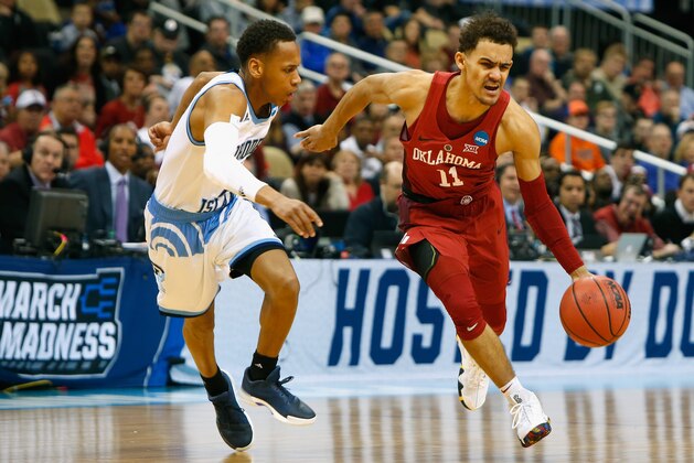PITTSBURGH, PA - MARCH 15:  Trae Young #11 of the Oklahoma Sooners is defended by Fatts Russell #2 of the Rhode Island Rams in the first half of the game during the first round of the 2018 NCAA Men's Basketball Tournament at PPG PAINTS Arena on March 15, 2018 in Pittsburgh, Pennsylvania.  (Photo by Justin K. Aller/Getty Images)
