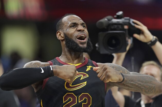 Cleveland Cavaliers' LeBron James celebrates after scoring the game-winning shot in the second half of Game 5 of an NBA basketball first-round playoff series against the Indiana Pacers, Wednesday, April 25, 2018, in Cleveland. The Cavaliers won 98-95. (AP Photo/Tony Dejak)