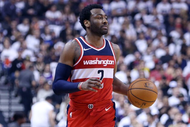 TORONTO, ON - APRIL 25:  John Wall #2 of the Washington Wizards dribbles the ball during the first half of Game Five against the Toronto Raptors in Round One of the 2018 NBA playoffs at Air Canada Centre on April 25, 2018 in Toronto, Canada.  NOTE TO USER: User expressly acknowledges and agrees that, by downloading and or using this photograph, User is consenting to the terms and conditions of the Getty Images License Agreement.  (Photo by Vaughn Ridley/Getty Images)'n