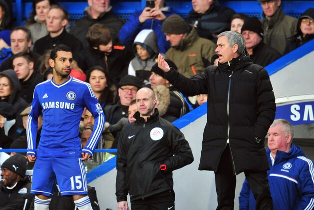Chelsea's Portuguese manager Jose Mourinho (R) gives instructions to Chelsea's Egyptian midfielder Mohamed Salah (L) during the English Premier League football match between Chelsea and Newcastle United at Stamford Bridge in west London on February 8, 2014. Chelsea won the game 3-0. AFP PHOTO / GLYN KIRK

RESTRICTED TO EDITORIAL USE. No use with unauthorized audio, video, data, fixture lists, club/league logos or live services. Online in-match use limited to 45 images, no video emulation. No use in betting, games or single club/league/player publications.        (Photo credit should read GLYN KIRK/AFP/Getty Images)