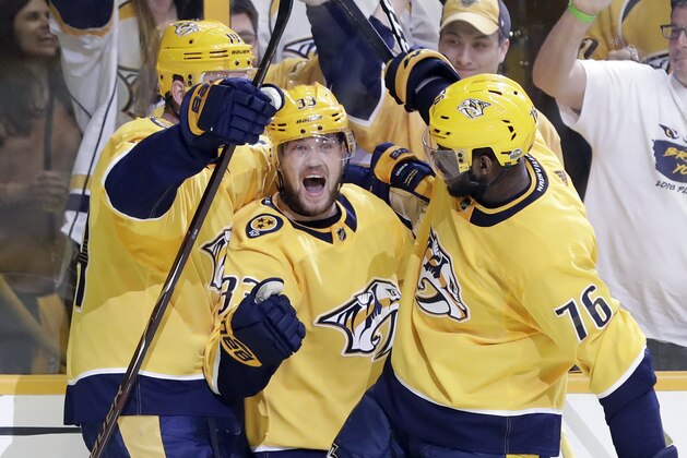 Nashville Predators left wing Viktor Arvidsson (33), of Sweden, celebrates with Mattias Ekholm (14), of Sweden, and P.K. Subban (76) after Arvidsson scored a goal against the Colorado Avalanche during the second period in Game 2 of an NHL hockey first-round playoff series Saturday, April 14, 2018, in Nashville, Tenn. (AP Photo/Mark Humphrey)