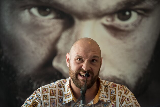 Former British heavyweight world boxing champion Tyson Fury attends a press conference to publicise his return to the ring at the Lowry Hotel in Manchester, north-west England on April 26, 2018. - Tyson Fury says he could beat reigning world heavyweight champion Deontay Wilder with 'a hand tied behind my back' as the British fighter nears his comeback after more than two years out of the ring. (Photo by Oli SCARFF / AFP) (Photo credit should read OLI SCARFF/AFP/Getty Images) Former British heavyweight world boxing champion Tyson Fury attends a press conference to publicise his return to the ring at the Lowry Hotel in Manchester, north-west England on April 26, 2018. - Tyson Fury says he could beat reigning world heavyweight champion Deontay Wilder with 'a hand tied behind my back' as the British fighter nears his comeback after more than two years out of the ring. (Photo by Oli SCARFF / AFP) (Photo credit should read OLI SCARFF/AFP/Getty Images)