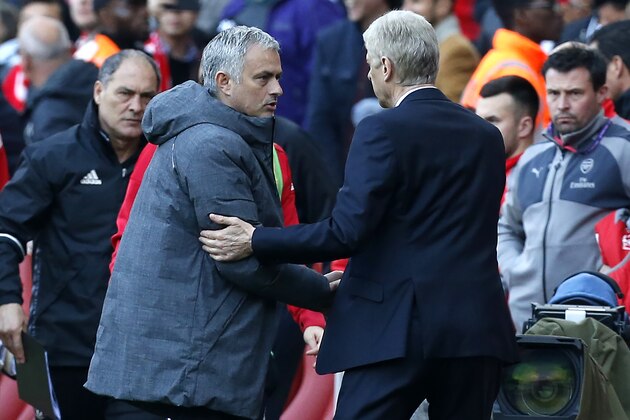 Arsenal's French manager Arsene Wenger shakes hands with Manchester United's Portuguese manager Jose Mourinho (2nd L) after the English Premier League football match between Arsenal and Manchester United at the Emirates Stadium in London on May 7, 2017. 
Arsenal won the game 2-0. / AFP PHOTO / IKIMAGES / Ian KINGTON / RESTRICTED TO EDITORIAL USE. No use with unauthorized audio, video, data, fixture lists, club/league logos or 'live' services. Online in-match use limited to 45 images, no video emulation. No use in betting, games or single club/league/player publications.  /         (Photo credit should read IAN KINGTON/AFP/Getty Images)