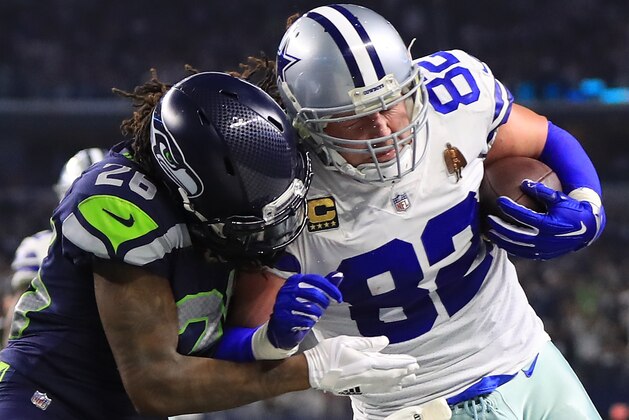 ARLINGTON, TX - DECEMBER 24:  Jason Witten #82 of the Dallas Cowboys is tackled by Shaquill Griffin #26 of the Seattle Seahawks in the second half at AT&T Stadium on December 24, 2017 in Arlington, Texas.  (Photo by Ronald Martinez/Getty Images)