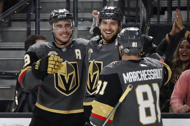 Vegas Golden Knights defenseman Shea Theodore, center, celebrates after scoring against the San Jose Sharks during the second period of Game 1 of an NHL hockey second-round playoff series, Thursday, April 26, 2018, in Las Vegas. (AP Photo/John Locher)