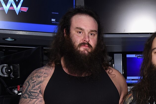 NEW YORK, NY - MARCH 29:  WWE Superstars Braun Strowman, Bray Wyatt and Erick Rowan ring The New York Stock Exchange Opening Bell in honor of WrestleMania 32  at New York Stock Exchange on March 29, 2016 in New York City.  (Photo by Jamie McCarthy/Getty Images)