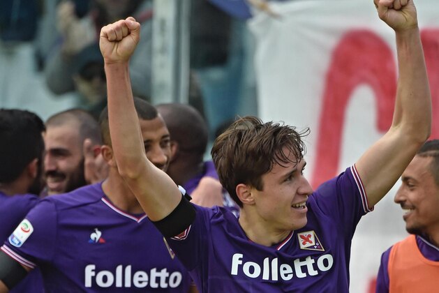 Fiorentina's Federico Chiesa with his teammates after scoring during the Serie A soccer match between Fiorentina and Crotone, at the Artemio FRanchi stadium in Florence, Italy, Saturday, March 31, 2018. (Maurizio Degl'Innocenti/ANSA via AP) Fiorentina's Federico Chiesa with his teammates after scoring during the Serie A soccer match between Fiorentina and Crotone, at the Artemio FRanchi stadium in Florence, Italy, Saturday, March 31, 2018. (Maurizio Degl'Innocenti/ANSA via AP)