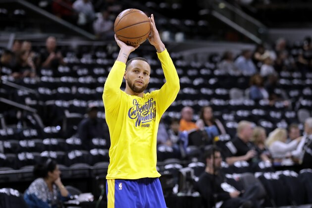 Golden State Warriors guard Stephen Curry (30) warms up before Game 3 of a first-round NBA basketball playoff series against the San Antonio Spurs on Thursday, April 19, 2018, in San Antonio. (AP Photo/Eric Gay)