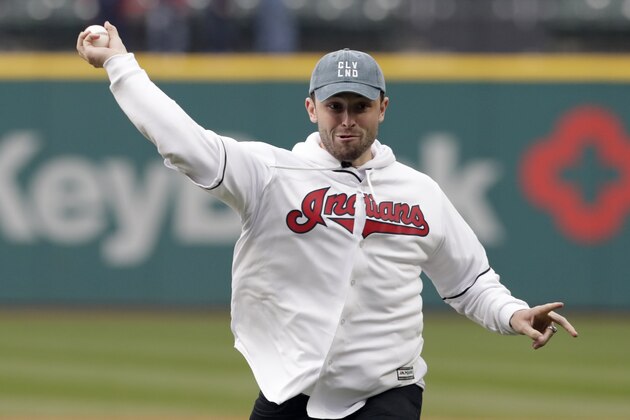 Cleveland Browns draft pick Baker Mayfield throws out the ceremonial first pitch before a baseball game between the Seattle Mariners and the Cleveland Indians, Friday, April 27, 2018, in Cleveland. (AP Photo/Tony Dejak)