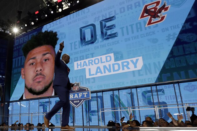 Former player Vince Young walks off the stage after announcing Boston College's Harold Landry as the Tennessee Titans' pick during the second round of the NFL football draft, Friday, April 27, 2018, in Arlington, Texas. (AP Photo/Eric Gay)