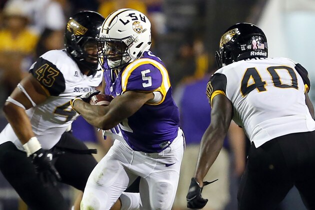 FILE - In this Oct. 15, 2016, file photo, LSU running back Derrius Guice (5) cuts between Southern Mississippi defensive lineman LaDarius Harris (43) and linebacker C.J. Perry (40) during the second half of an NCAA college football game in Baton Rouge, La. Guice, a junior who emerged as LSU’s leading rusher last season, enters the 2017 campaign as the most accomplished and dynamic player in a new offense installed by first-year coordinator Matt Canada.  (AP Photo/Butch Dill, File)