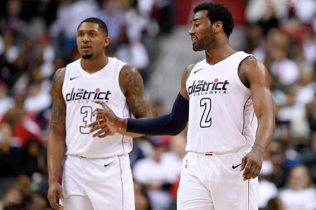 Washington Wizards guard John Wall (2) gestures in front of Bradley Beal (3) during the second half of Game 3 of an NBA basketball first-round playoff series against the Toronto Raptors, Friday, April 20, 2018, in Washington. The Wizards won 122-103. (AP Photo/Nick Wass)