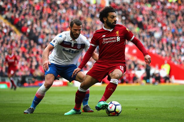 LIVERPOOL, ENGLAND - APRIL 28:  Mohamed Salah of Liverpool and Kevin Wimmer of Stoke City in action during the Premier League match between Liverpool and Stoke City at Anfield on April 28, 2018 in Liverpool, England.  (Photo by Clive Brunskill/Getty Images)