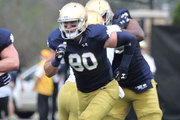 FILE - In this April 18, 2015, file photo, Notre Dame tight end Durham Smythe (80) heads down field during the Blue Gold spring NCAA college football game in South Bend, Ind. Smythe knows heading into Saturday night’s, Sept. 5 season-opener against Texas his hold on the starter’s job is tenuous.(AP Photo/Joe Raymond, File)