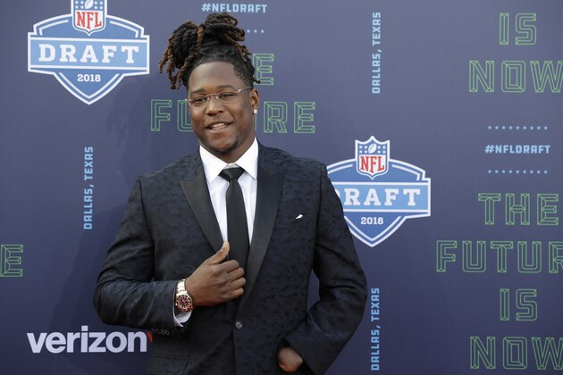 Central Florida's Shaquem Griffin poses for photos on the red carpet before the first round of the NFL football draft, Thursday, April 26, 2018, in Arlington, Texas. (AP Photo/Eric Gay)