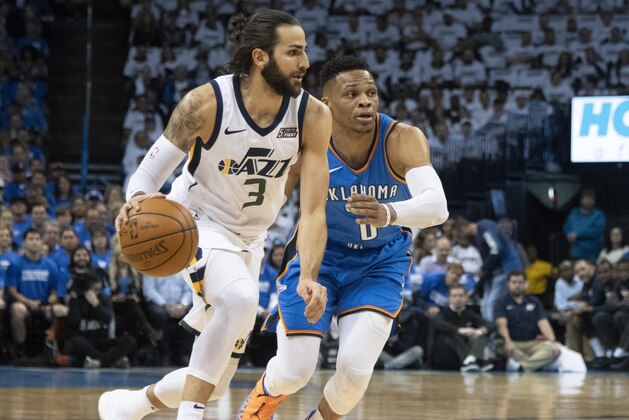 OKLAHOMA CITY, OK - APRIL 25:  Ricky Rubio #3 of the Utah Jazz brings the ball up court as Russell Westbrook #0 of the Oklahoma City Thunder applies pressure during game 5 of the Western Conference playoffs at the Chesapeake Energy Arena on April 25, 2018 in Oklahoma City, Oklahoma. NOTE TO USER: User expressly acknowledges and agrees that, by downloading and or using this photograph, User is consenting to the terms and conditions of the Getty Images License Agreement. (Photo by J Pat Carter/Getty Images)