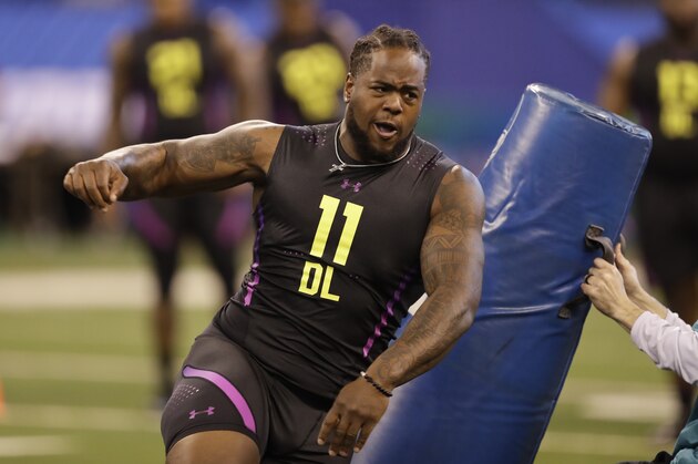 Tennessee defensive lineman Kahlil McKenzie runs a drill during the NFL football scouting combine, Sunday, March 4, 2018, in Indianapolis. (AP Photo/Darron Cummings)