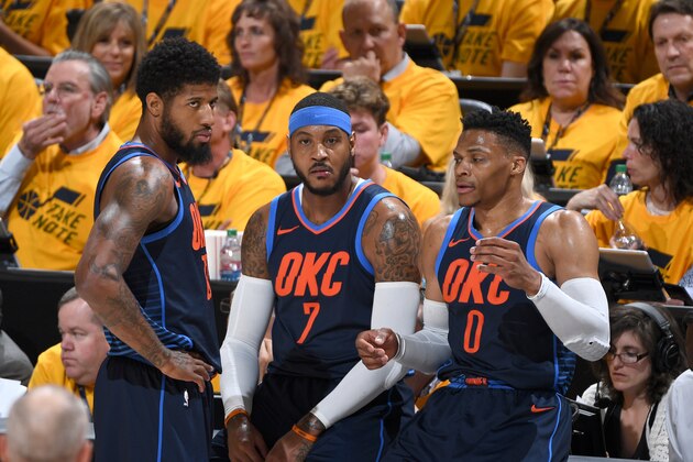 SALT LAKE CITY, UT - APRIL 27: Paul George #13, Carmelo Anthony #7, and Russell Westbrook #0 of the Oklahoma City Thunder in Game Six of the Western Conference Quarterfinals against the Utah Jazz during the 2018 NBA Playoffs on April 27, 2018 at Vivint Smart Home Arena in Salt Lake City, Utah. NOTE TO USER: User expressly acknowledges and agrees that, by downloading and/or using this photograph, user is consenting to the terms and conditions of the Getty Images License Agreement. Mandatory Copyright Notice: Copyright 2018 NBAE (Photo by Garrett Ellwood/NBAE via Getty Images)