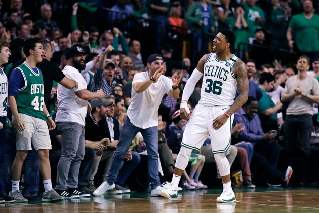 Boston Celtics guard Marcus Smart (36) celebrates a basket with fans during the second quarter of Game 7 of an NBA basketball first-round playoff series against the Milwaukee Bucks in Boston, Saturday, April 28, 2018. (AP Photo/Charles Krupa)