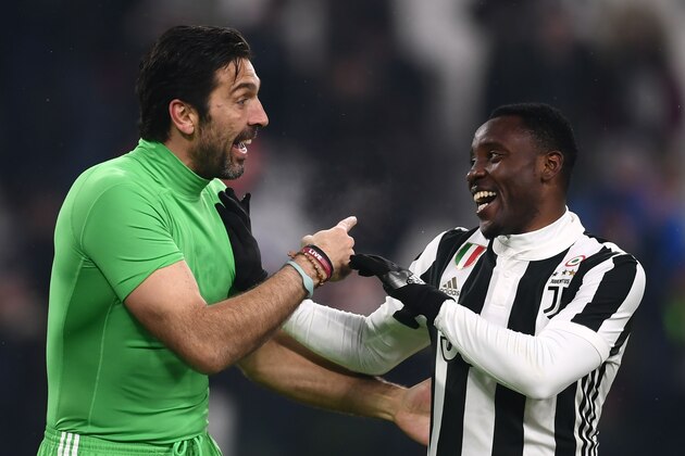 TOPSHOT - Juventus' midfielder Kwadwo Asamoah from Ghana (R) chats with Juventus' goalkeeper Gianluigi Buffon during the Italian Tim Cup football match between Juventus and Atalanta at the 'Allianz Stadium' in Turin on February 28, 2018. / AFP PHOTO / MARCO BERTORELLO        (Photo credit should read MARCO BERTORELLO/AFP/Getty Images)