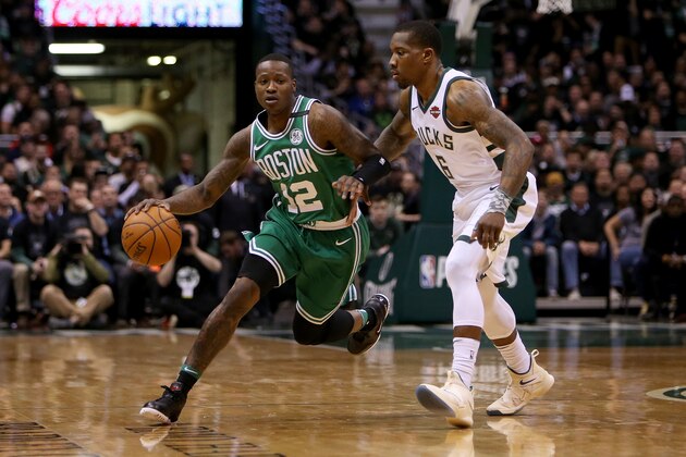 MILWAUKEE, WI - APRIL 26:  Terry Rozier #12 of the Boston Celtics dribbles the ball while being guarded by Eric Bledsoe #6 of the Milwaukee Bucks in the first quarter during Game Six of Round One of the 2018 NBA Playoffs at the Bradley Center on April 26, 2018 in Milwaukee, Wisconsin. NOTE TO USER: User expressly acknowledges and agrees that, by downloading and or using this photograph, User is consenting to the terms and conditions of the Getty Images License Agreement. (Photo by Dylan Buell/Getty Images)