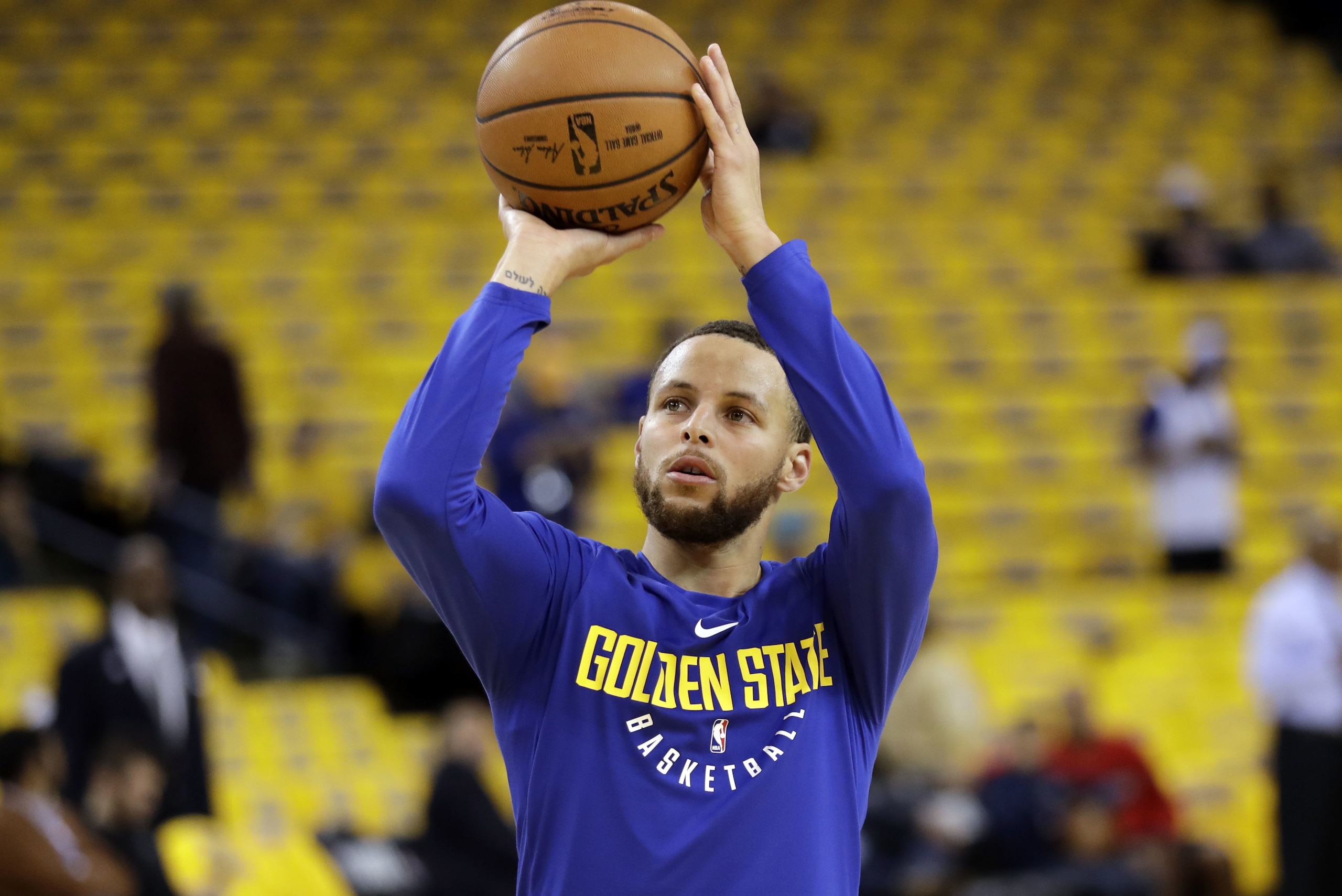 Golden State Warriors' Stephen Curry shoots during warmups before Game 1 of an NBA basketball second-round playoff series against the New Orleans Pelicans, Saturday, April 28, 2018, in Oakland, Calif. (AP Photo/Marcio Jose Sanchez)