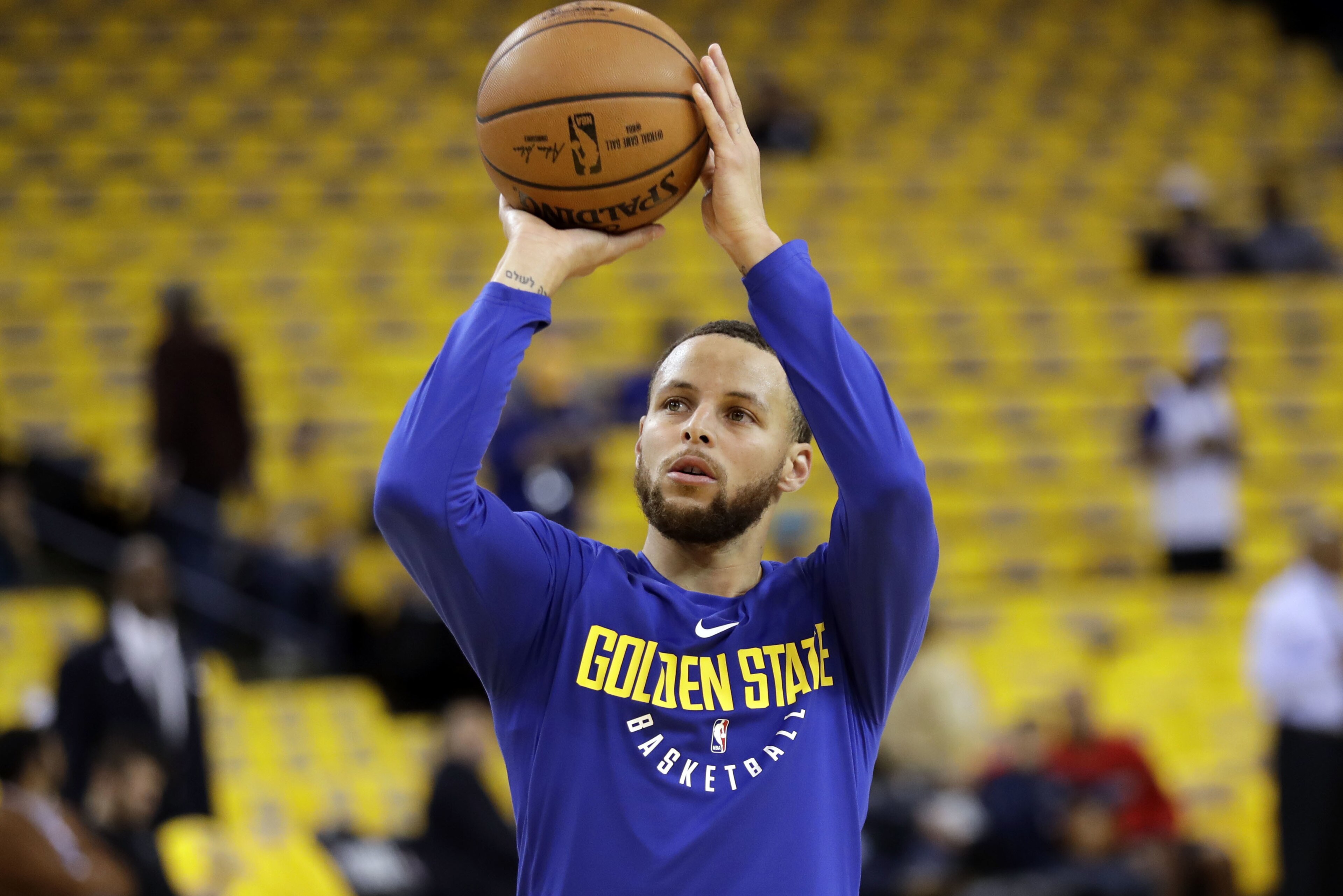 Golden State Warriors' Stephen Curry shoots during warmups before Game 1 of an NBA basketball second-round playoff series against the New Orleans Pelicans, Saturday, April 28, 2018, in Oakland, Calif. (AP Photo/Marcio Jose Sanchez)