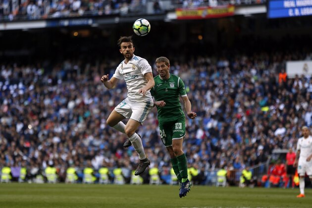 Real Madrid's Borja Mayoral, left, goes for a header with Leganes' Darko Brasanac during a Spanish La Liga soccer match between Real Madrid and Leganes at the Santiago Bernabeu stadium in Madrid, Saturday, April 28, 2018. Mayoral scored once in Real Madrid's 2-1 victory. (AP Photo/Francisco Seco)