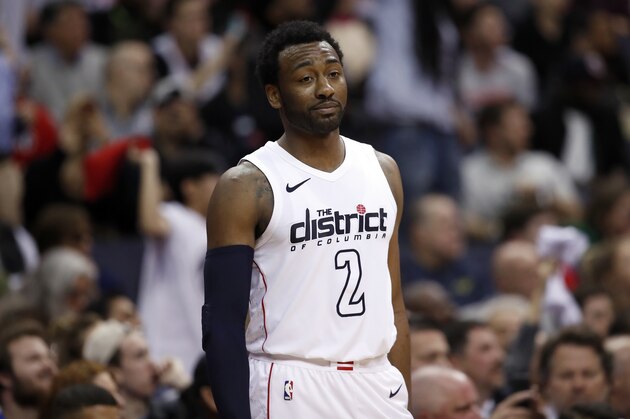 Washington Wizards guard John Wall (2) looks a the Toronto Raptors bench in the second half of Game 6 of an NBA basketball first-round playoff series, Friday, April 27, 2018, in Washington. The Raptors won 102-92. (AP Photo/Alex Brandon)
