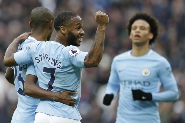 Manchester City's Raheem Sterling, celebrates after teammate Manchester City's Fernandinho, left, scored his side's forth goal during the English Premier League soccer match between West Ham United and Manchester City at the London stadium in London, Sunday, April, 29, 2018. City won the match 4-1. (AP Photo/Alastair Grant)